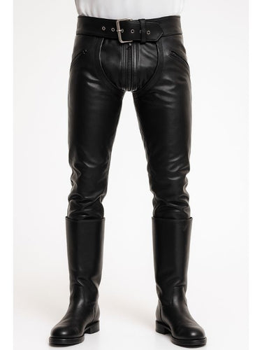 Gay leatherman wearing black leather convertible chaps pants in front view