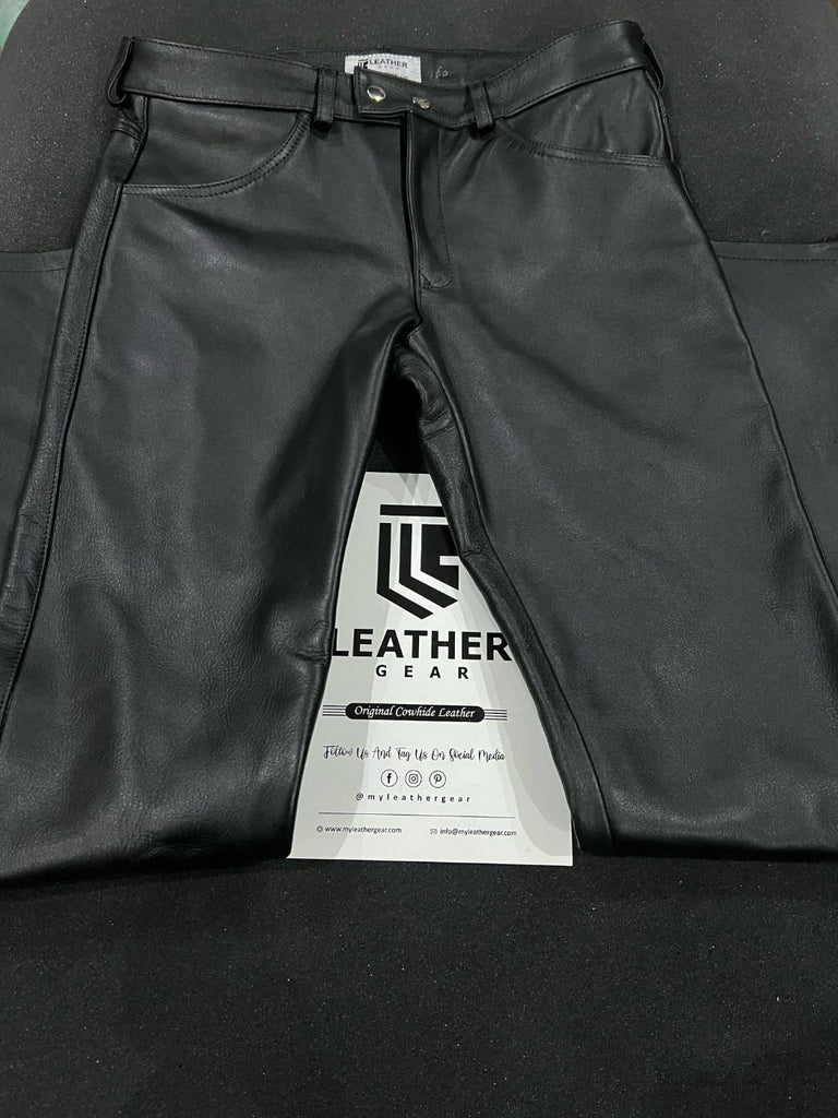 Classic gay leather pants styled with harness and boots – front view