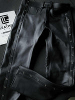 Lade das Bild in den Galerie-Viewer, Front flat lay of black leather fetish pants with white stitching and belt loops, ideal for gay pants styling and leather gear uniforms.
