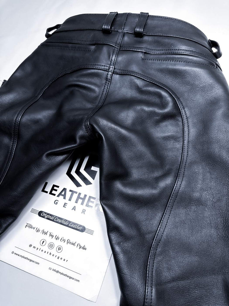 Black leather pants with a visible 'Leather Gear' tag on a light gray background