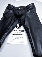Charger l'image dans la galerie, Black leather pants with a visible brand label on a white background
