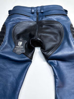 Charger l'image dans la galerie, Blue leather pants with a visible brand label on a white background
