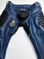 Charger l'image dans la galerie, Blue leather pants with black accents on a white background
