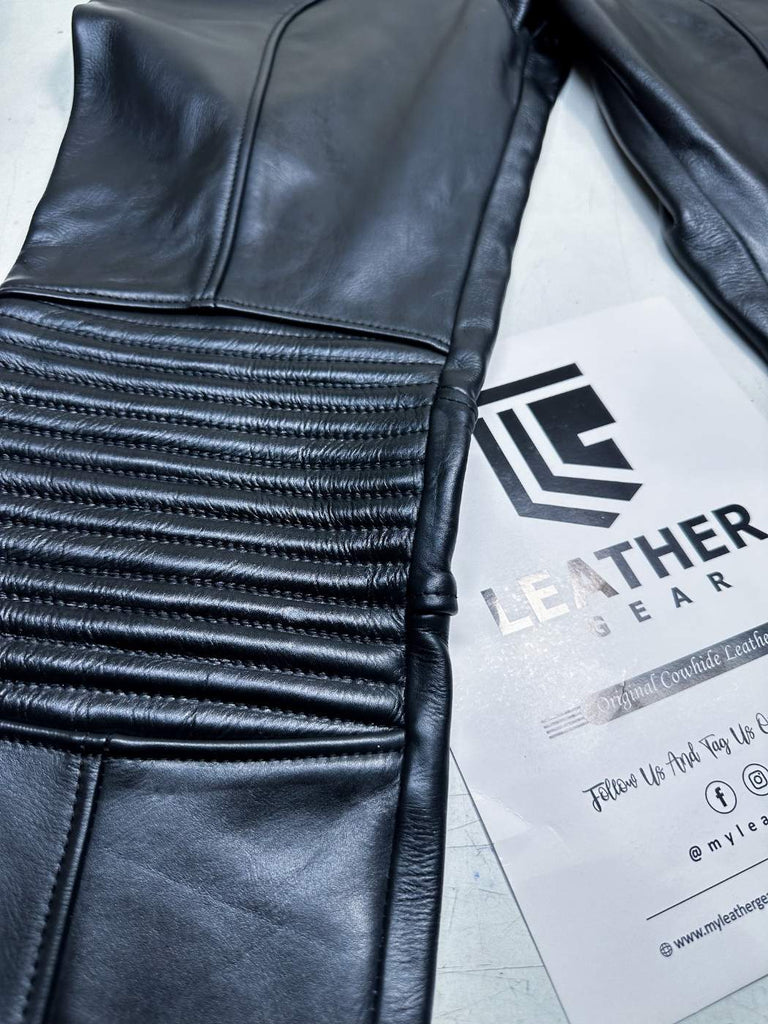 Close-up of black leather jacket with visible stitching, on a white background with 'Leather Gear' branding.