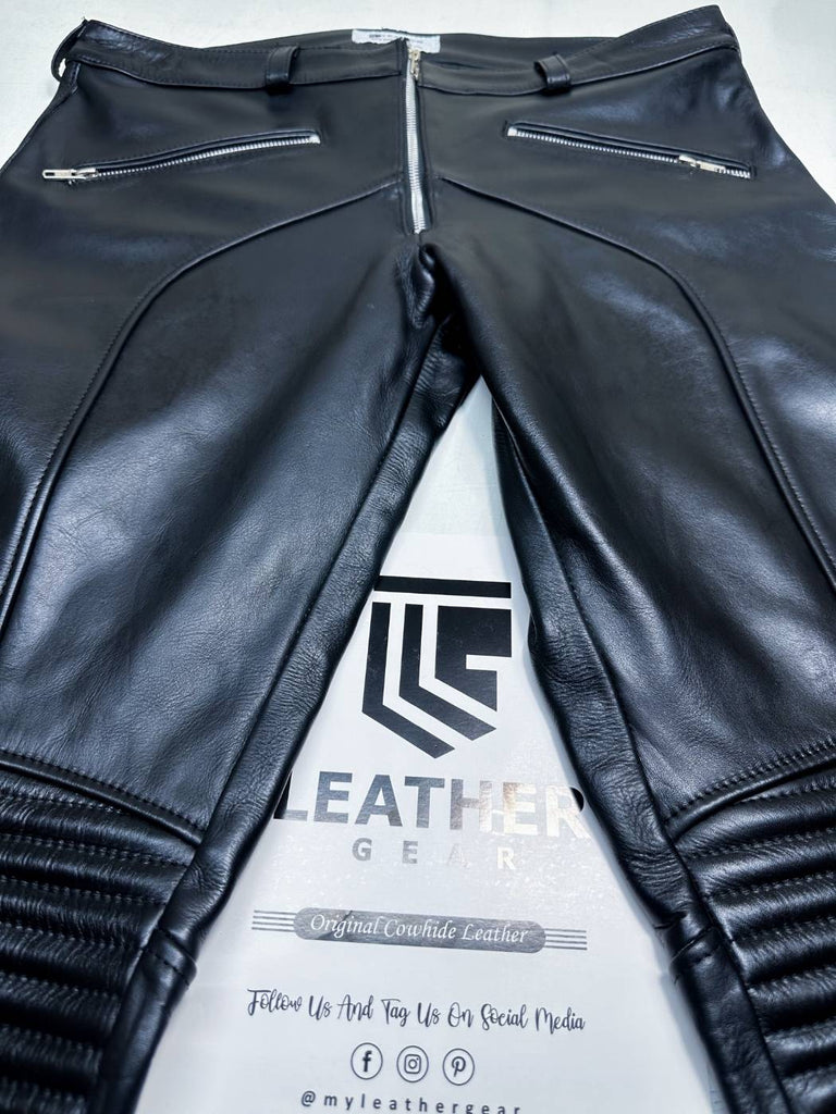 front shot of tight-fit black leather biker pants with YKK zipper fly and low-rise waist.
