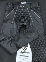 Load image into Gallery viewer, Flat lay front view of leather padded pants – double zip fly and codpiece detail in black full-grain leather
