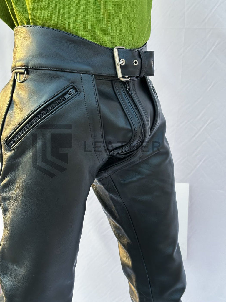 Leatherman posing in convertible fetish pants with low-rise cut