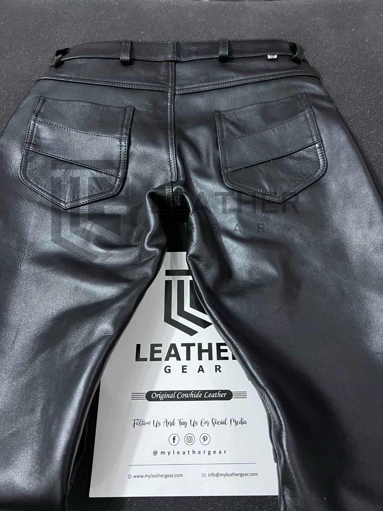 Rear flat-lay of cowhide leather pants with back pockets and clean stitching