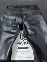 Load image into Gallery viewer, Rear flat-lay of cowhide leather pants with back pockets and clean stitching
