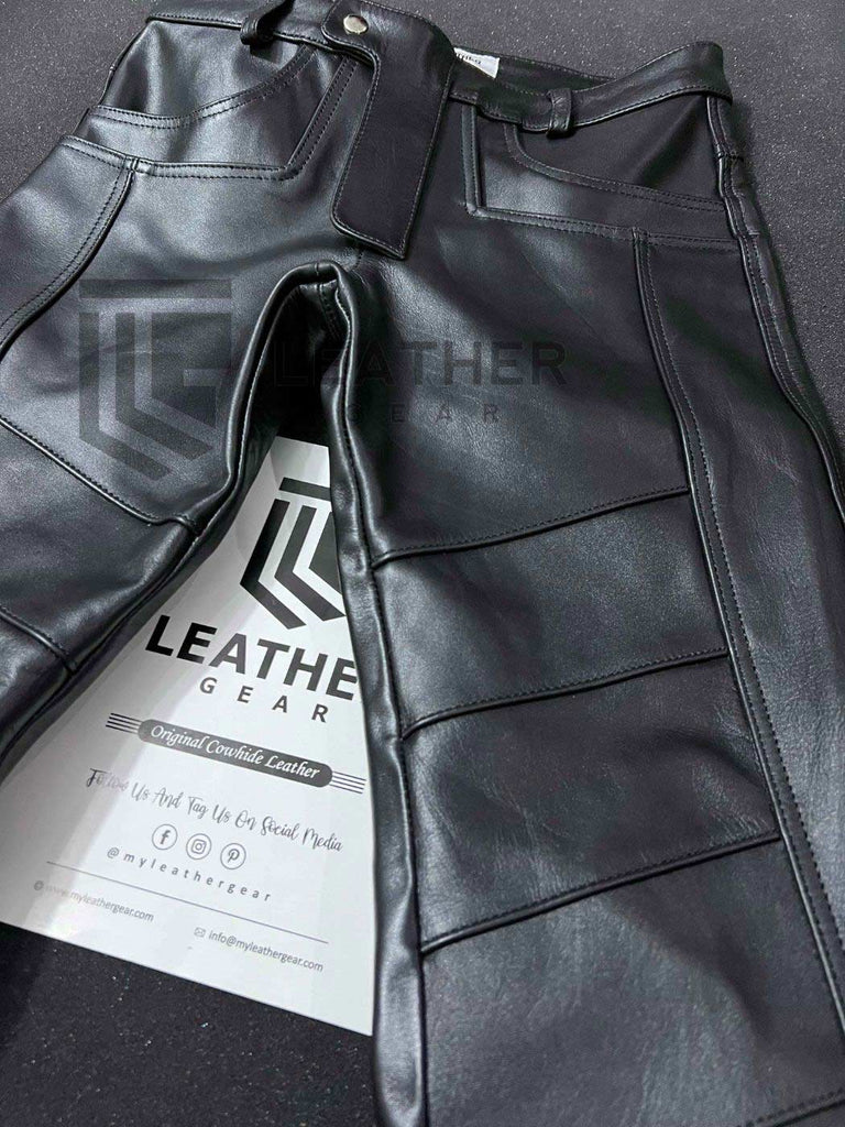 Black leather fetish jeans pants laid flat showing front zipper and pockets
