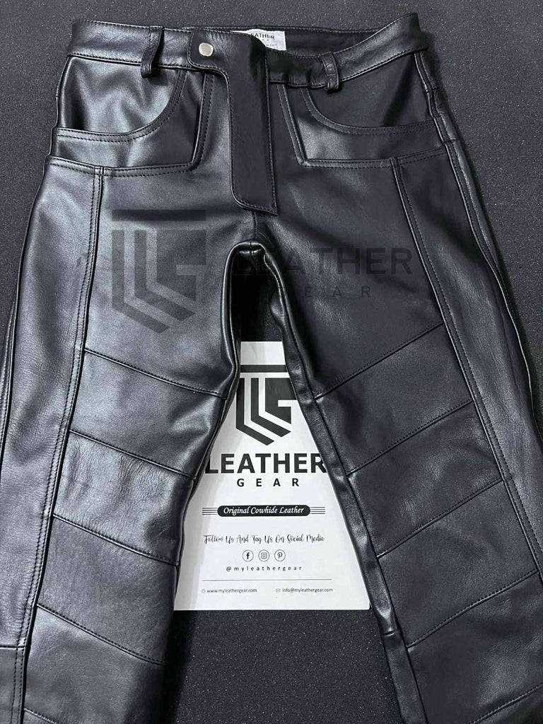 Folded flat view of tight fit black leather pants for gay leathermen