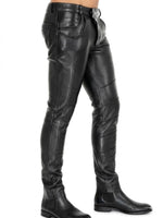 Charger l'image dans la galerie, Black leather pants worn by a person on a white background

