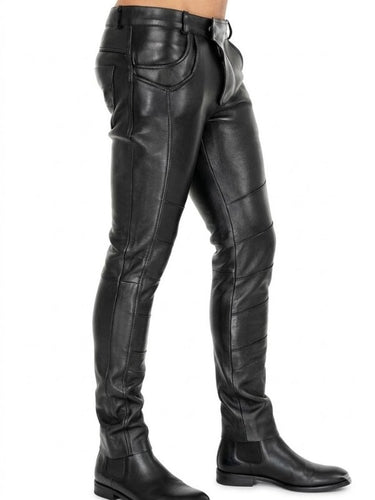 Black leather pants worn by a person on a white background