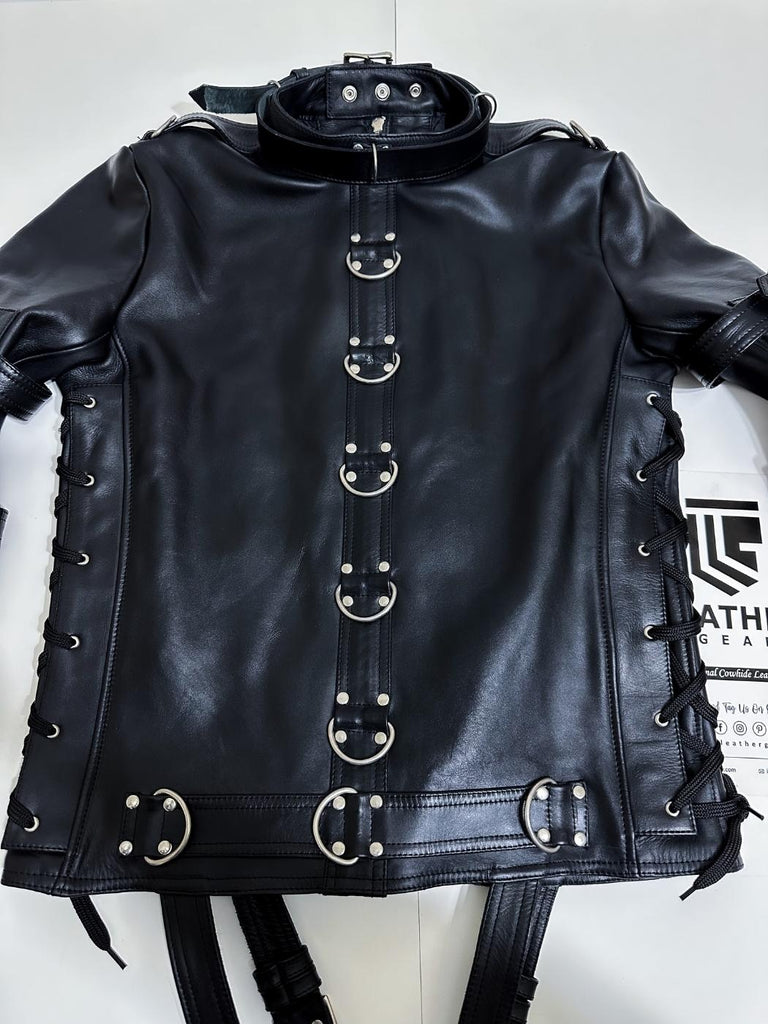 Black leather jacket with metal buckles on a white background