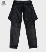 Lade das Bild in den Galerie-Viewer, Leather Ranger Pants back side laying flat  – showing back pockets, black leather ass saddle, and leg contour.
