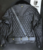 Load image into Gallery viewer, Laying flat back pose of gay leather biker uniform jacket with padded shoulders and removable fur collar by Leather gear
