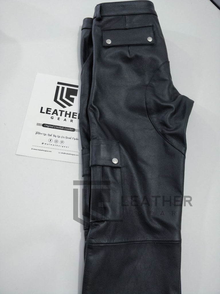 Folded view of black leather cargo pants – gay jeans-inspired fetishwear with zip fly and belt loops