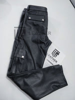 Load image into Gallery viewer, Folded back of leather cargo pants – full-grain cowhide, double-stitched seams, and leather bar uniform styling
