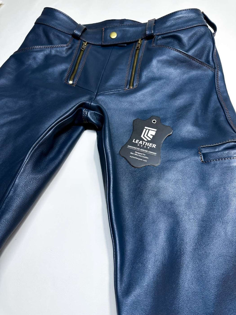 Blue leather pants with a brand tag on a white background
