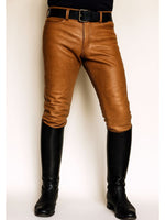 Load image into Gallery viewer, Front view of Tan Leather Fetish Jeans – slim-fit cowhide pants for gay leathermen with low-rise waist and bold fetish style
