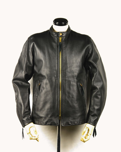 The Rider Leather Jacket in black full-grain leather, showcasing its long silhouette, YKK zipper, and stand collar design — ideal for BLUF and gay leather gear.