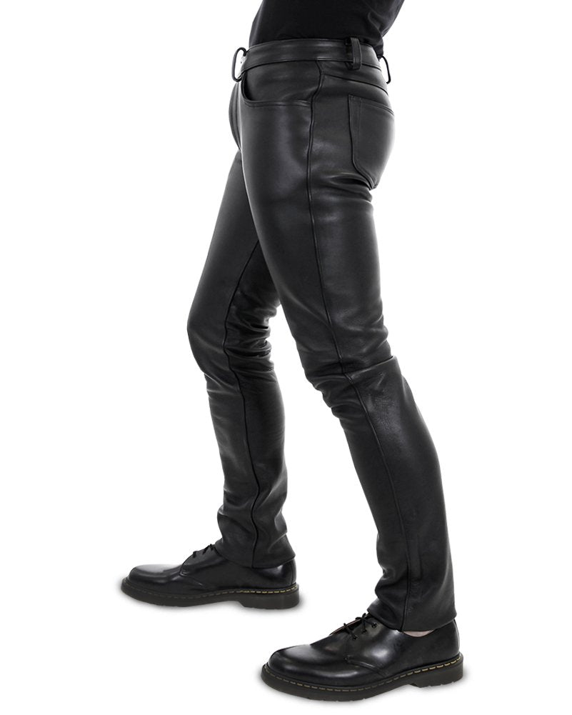 Gay leatherman modeling slim-fit leather pants with button front – side angle