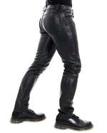 Load image into Gallery viewer, Side profile of tight fit black leather jeans pants hugging thighs – Leather Gear essential
