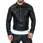 Load image into Gallery viewer, Front view of man wearing leather denim jacket with buttons closed – gay leather streetwear
