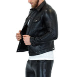 Load image into Gallery viewer, Left side view of man in black leather denim jacket – edgy gay leather fashion
